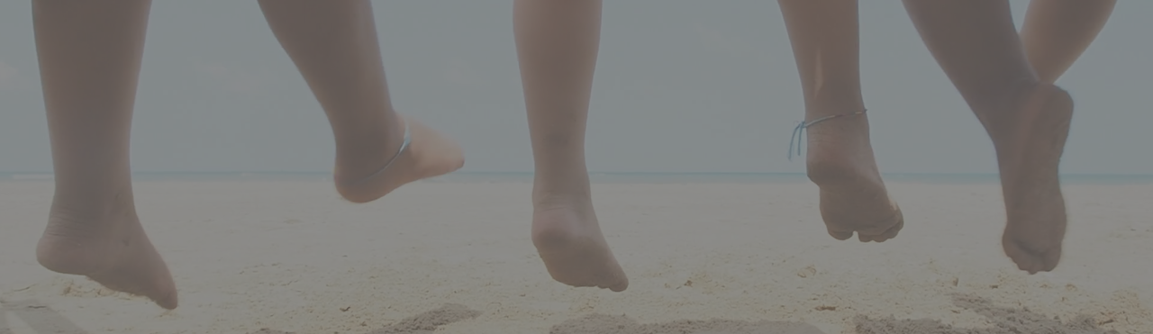 image of dangling feet at the beach